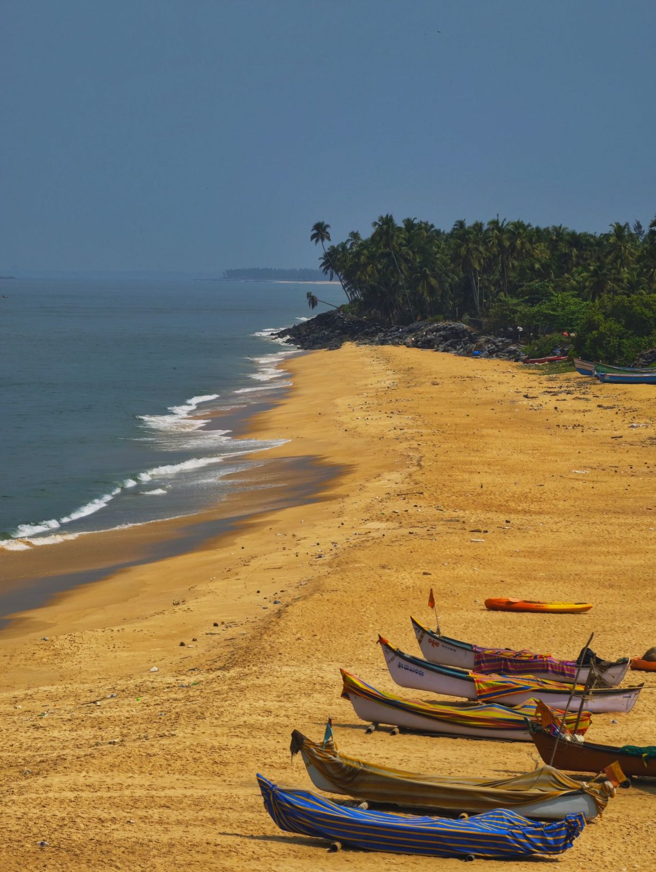 Colourful fishing boats on the coastal Karnataka shore