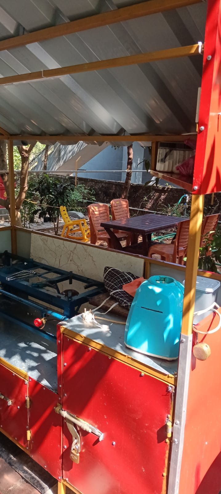 Covered outdoor cooking and seating area