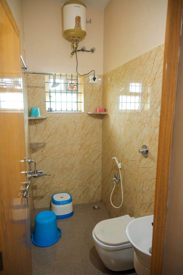 Bathroom with hot-water geyser